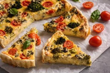 Homemade tart with broccoli, tomatoes and blue cheese.