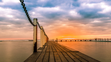 Obraz premium Poolside. Sunrise at Narrabeen Pools, Northern Beaches of Sydney.