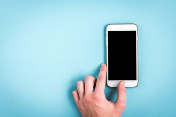 Mobile phone on blue background.