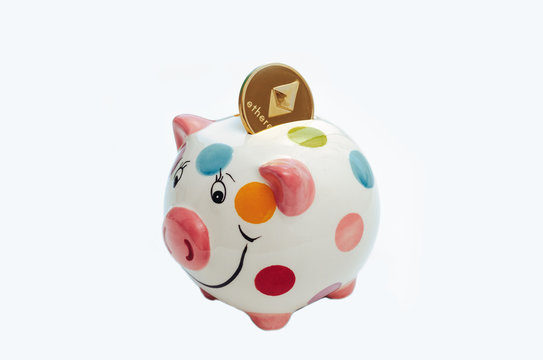 piggy bank with cryptocurrency on a white background. Symbol of the new year.