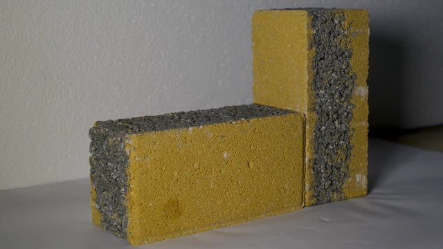 Close-up view of concrete blocks for self-locking paving of roads and sidewalk. It is evident the drainage capacity of the blocks that allows the evacuation of rainwater.