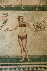 Fototapeta na wymiar Ancient bikini girl of mosaic stones in Sicily