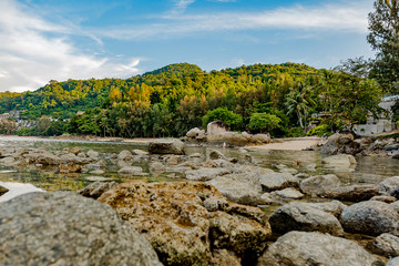 Beautiful seascape. Sea, mountains, sky, sunset and palm trees. Beautiful places of the island of Phuket, Thailand.