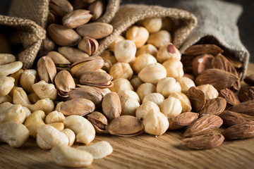 mix of nuts on a wooden table