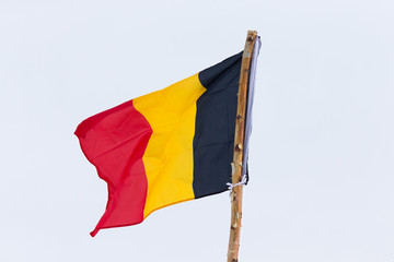 Flag of different Germany on the background of the gloomy sky