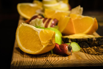 delicious fruits on the wooden plank