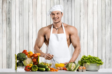 Man bodybuilder on kitchen