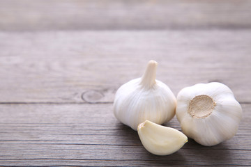 Fresh garlic on a grey wooden background