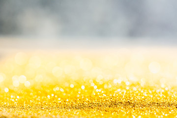 Gold glitter close-up background with shallow depth of field