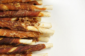 Natural treats for dogs jerky close up. White background and copy space 