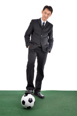 Business man and his leather ball.