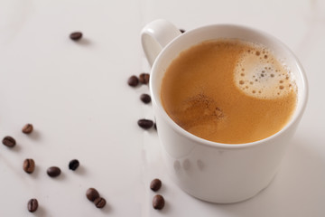 cup of coffee on white marble.