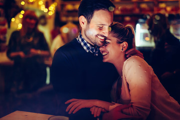 Romantic couple dating in pub at night