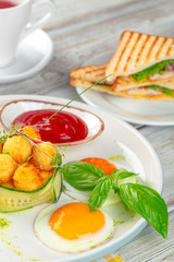 Club sandwich panini with ham, tomato, cheese and basil with cheese balls