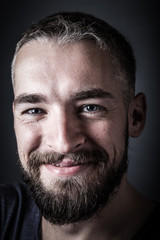 Portrait of a young man with a beard. Toned