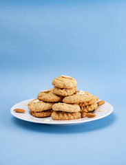 Gluten-Free Cookies almond with almond slice in white plate.
