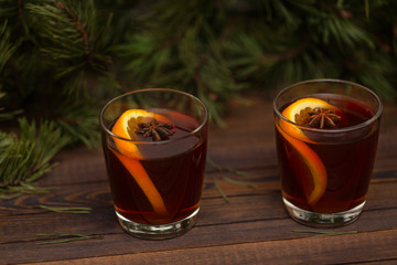 Christmas mulled wine on wooden background  