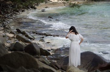 Beautiful young girl on summer vacation at the sea