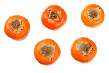 fresh ripe persimmons with slices isolated on white background. top view