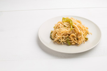 Noodles with bell pepper on plate
