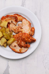 grilled turkey with vegetables on white plate