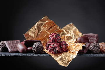 Various chocolates on a black background.