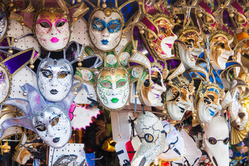 Person wearing venitian carnival mask during Venice carnival in Italy