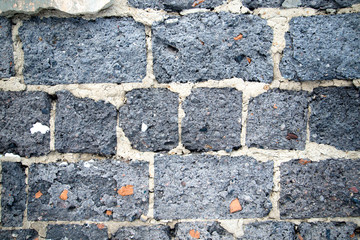 old gray brick ruined wall