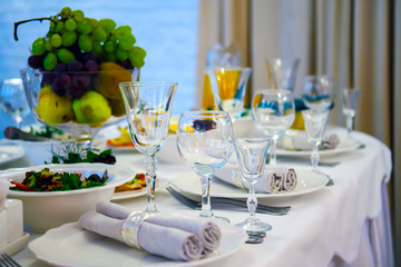The table is luxurious with food in the restaurant. Festive meal on the table.