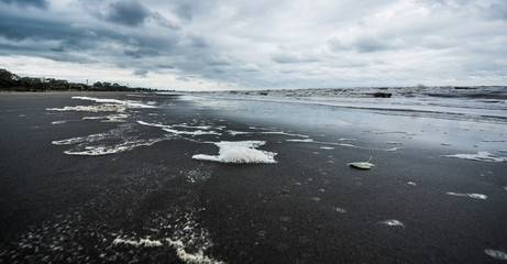 Fototapeta premium Caspian sea under blue sky in early September, snag on the beach