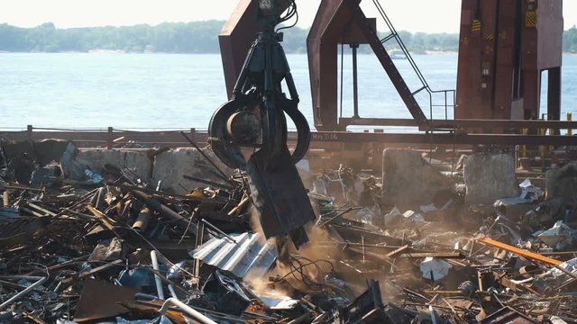 Scrap metal, crane and train in port