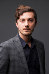Studio portrait of young man on a dark background