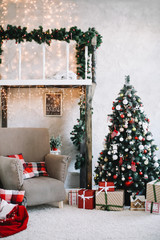 New Year festive interior. Holiday concept. Decorated Christmas tree with gifts. Decorated Christmas porch. 