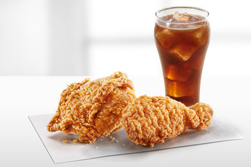 crispy coated batter southern style fried chicken in a wooden table