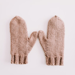 Warm knitted mittens isolated on white background. Flat lay, top view.