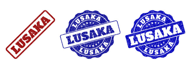 LUSAKA grunge stamp seals in red and blue colors. Vector LUSAKA labels with draft texture. Graphic elements are rounded rectangles, rosettes, circles and text labels.