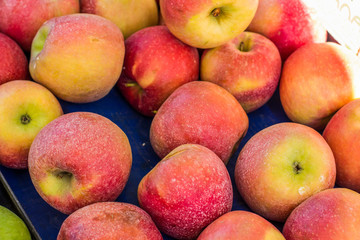 soft focus red fresh apple fruits  background on market counter