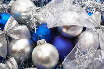 Close-up shot of silver and blue Christmas decorations, selective focus