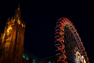 Christmas ferris wheel in front of the cathedral of Metz. Metz, France. Winter holidays background.	
