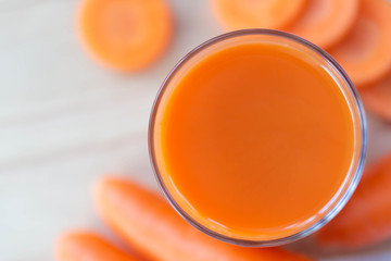 Closeup top view glass of carrot juice and fresh carrot , healthy diet food drink