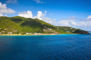 Fototapeta na wymiar Coastline along a Road Town in Tortola. Caribbean sea