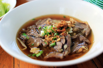 Stewed beef noodle soup with vegetable Thai local street food.