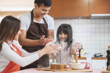 Happy Asian family cooking in kitchen, with happy and smile, lifestyle happy family concept