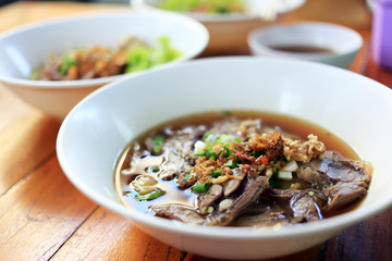 Stewed beef noodle soup with vegetable Thai local street food.