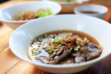 Stewed beef noodle soup with vegetable Thai local street food.