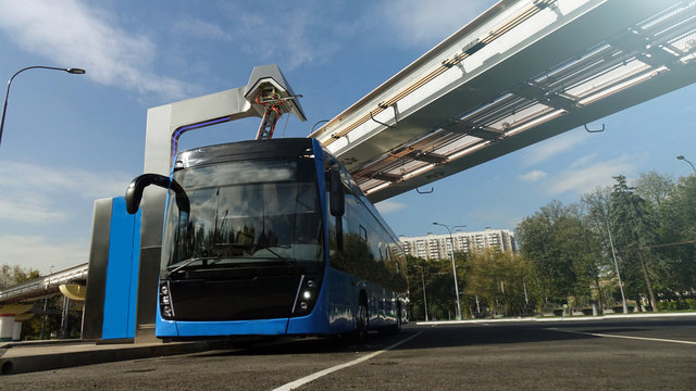 Blue Electric Bus At The Charging Station.Modern Trains On The Monorail.