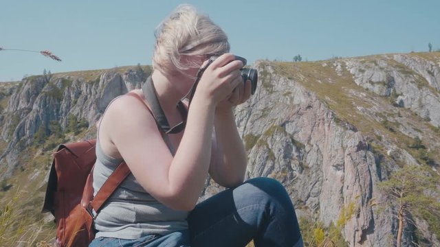 female photographer in the mountains