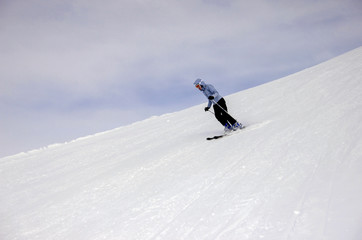 Naklejka na ściany i meble Skier on skiing trace
