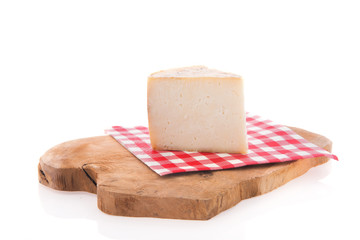 Goat cheese on cutting board