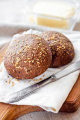 Homemade rye buns with linseeds, sesame and white poppy seeds